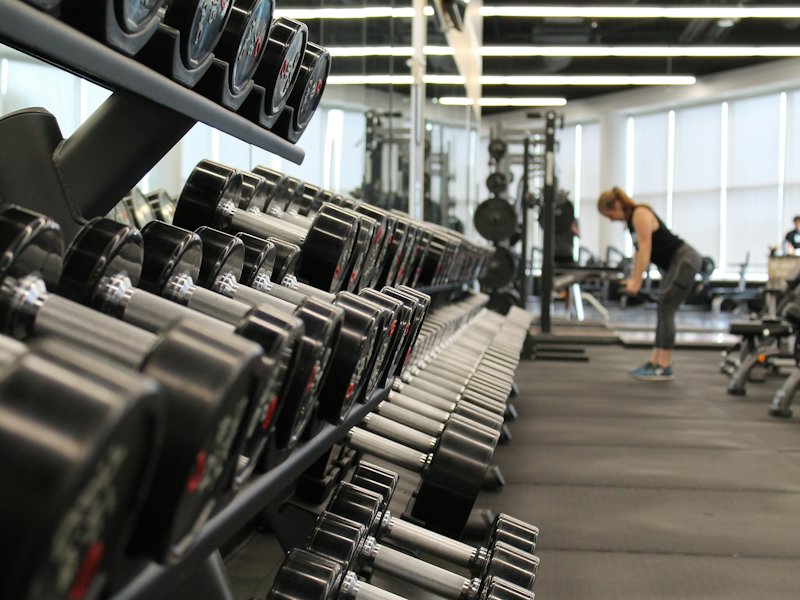 Gym with rows of dumbbells